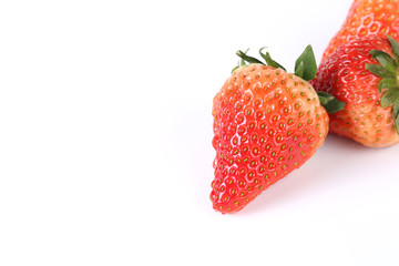Delicious strawberries on a white background