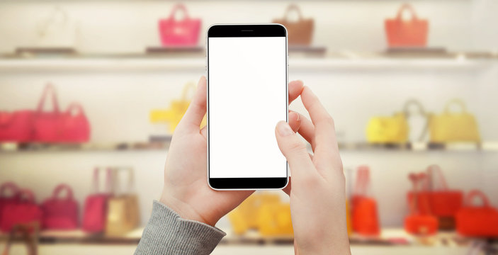 Women holding smart phone in shoe store, shopping online mockup