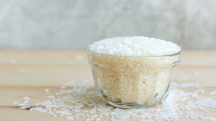 jasmine rice in a bowl on a wooden background.