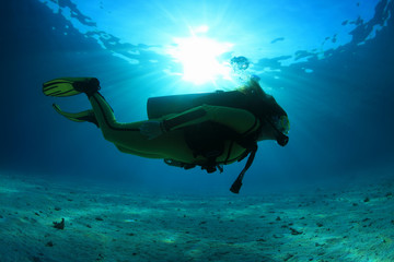 Silhouette of scuba diver