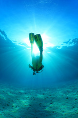 Silhouette of scuba diver