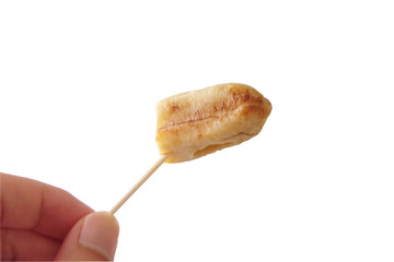 hand holding banana roast on stick on isolate have clipping path