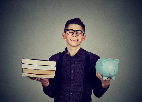 Student loan concept. Man with pile of books and piggy bank