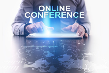 Businessman is using tablet pc and selecting online conference.