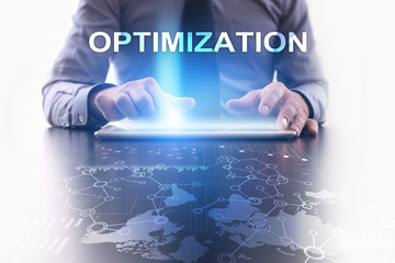 Businessman is using tablet pc and selecting optimization.