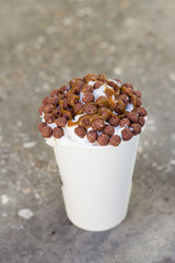 whiped cream and chocolate crisps on late coffe to go