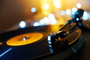 Blurred detail of a gramophone and record to listen to. Included gramophone and the torque plate...