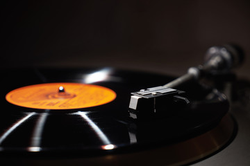 Gramophone and record to listen to. Included gramophone and the torque plate close-up on a bright background    