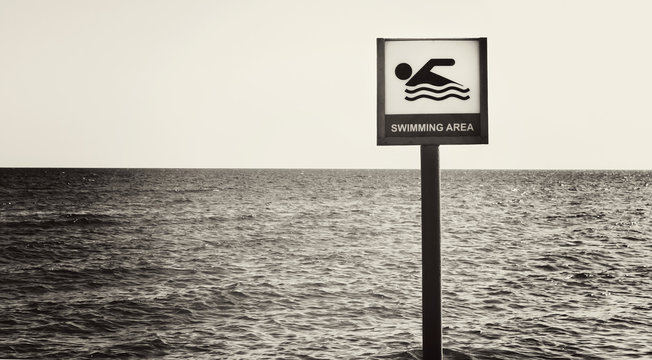 Fototapeta sign can float on the sea beach in black and white