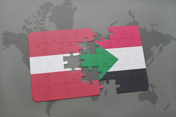 puzzle with the national flag of latvia and sudan on a world map