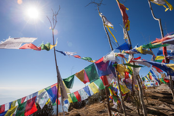 Buddhist prayer flags on a mountaintop in the Himalayas
