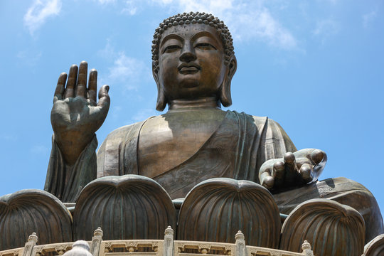 Giant Bronze Tian Tan Buddha statue on Lantau Island hillside