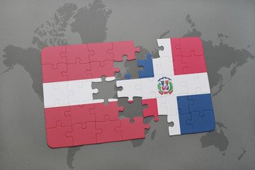 puzzle with the national flag of latvia and dominican republic on a world map