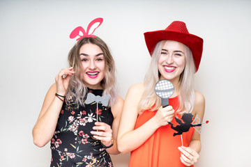 happy ladies girls female with fancy dress photo booth props smile party white isolated background