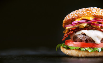 Delicious fresh homemade burger on a wooden table