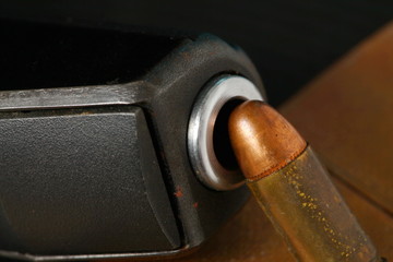 The pistol and bullet scene represent the weapon abstract concept related idea.