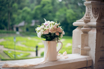 Wedding bouquet on the window of the old castle