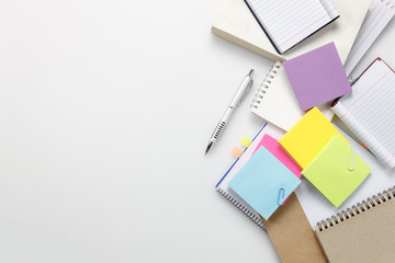 Top view  accessories business office desk.notebook pen paper note on white background with copy space.