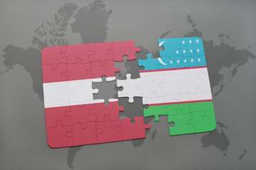 puzzle with the national flag of latvia and uzbekistan on a world map