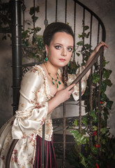 Beautiful woman in old historic medieval dress