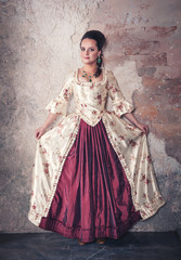 Beautiful woman in old historic medieval dress