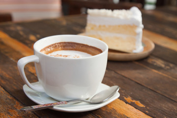 Coffee, cakes, on a wooden table.