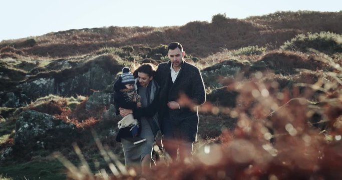 Happy Young Family with enjoying nature together, outdoors. Sunset. Slow motion, high speed camera. 4k.