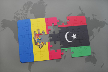 puzzle with the national flag of moldova and libya on a world map