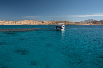White yacht in the Red sea with blue water