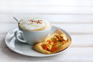 gourmet dessert/ frothy coffee in a cup and pastry with fruit on the table