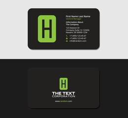 Obraz premium black business cards with the green letter H, stationery