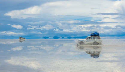 Off-road vehicles driving in Salar de Uyuni, Bolivia, the world's largest salt flat