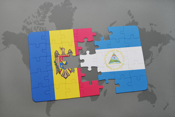 puzzle with the national flag of moldova and nicaragua on a world map