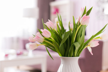 Beautiful fresh pink tulip flowers bouquet. View with copy space. Selective focus. Tulips in interior.