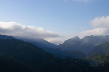 misty mountains with sky and cloud at morning.
