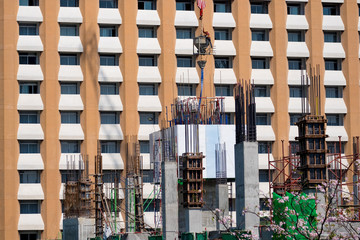 Workers were pouring concrete pillar of the building.