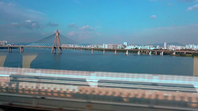 4K Views of the bridge Seoul city and the famous Han River from the train window-Dan