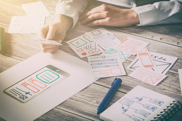 Designer drawing website ux app development.