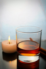 whiskey, cinnamon and candle