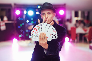 Magician showing trick with playing cards. Magic, circus © standret