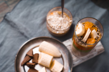 Smoothies and banana slices on a tin plate top view