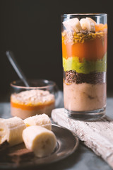 Banana smoothie, flax seed, avocado, pumpkin layers side view