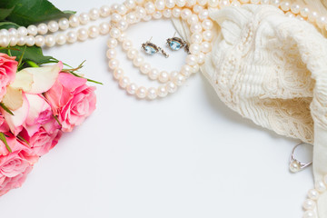 Female accessories frame with freash roses bouquet and copy space