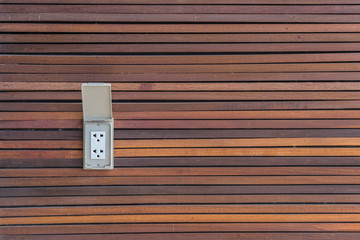 Electric plug on wood texture