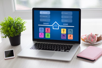 notebook with app smart home and phone desk in room