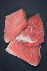 raw meat of pork on a dark background