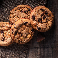 Chocolate chip cookies,  freshly baked on rustic wooden table. Selective Focus. Copy space.