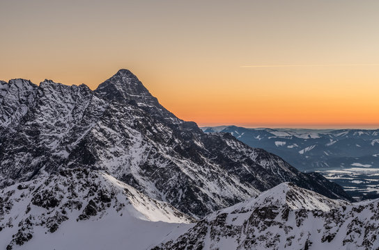 Poland, Winter High Tatras with Krivan peak seen from Zawrat pass in the evening