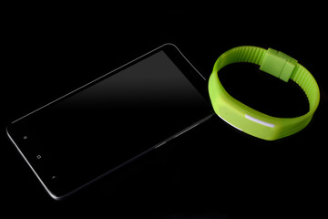 fitness bracelet on a dark background. sport. fitness. smart phone smartphones