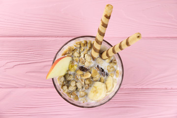 Fruit muesli in a bowl with apple and banana